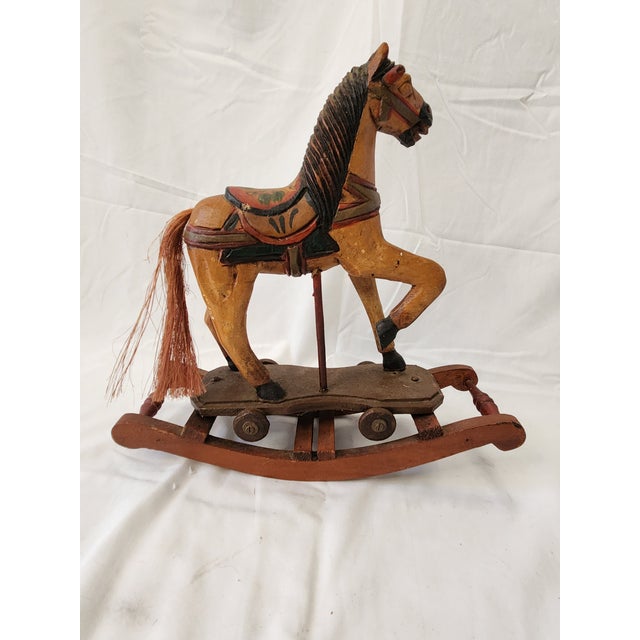 Delve into the charm of yesteryear with this Vintage 1950's Decorative Hand-Crafted Carousel Rocking Horse. A delightful...