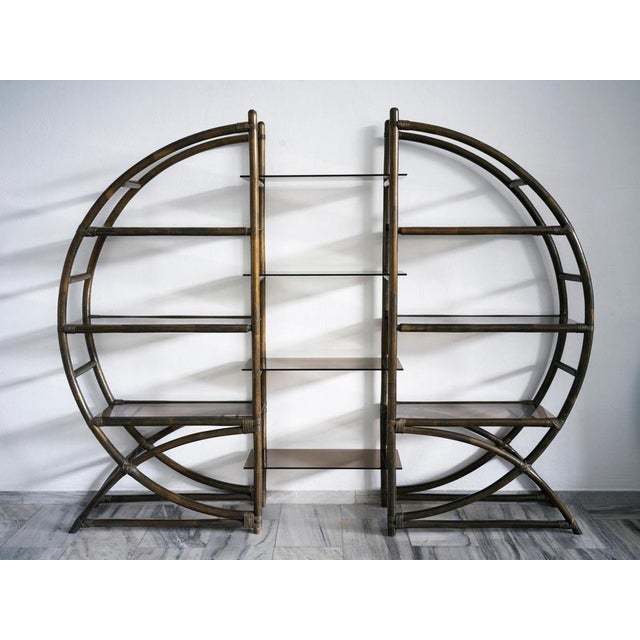 Extendable brown/dark green bamboo shelving units with smoked brown glass shelves. The bookcase has circular shape and can...