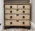 19th century English Victorian era chest of drawers with the original ivory paint. Features the original bronze...