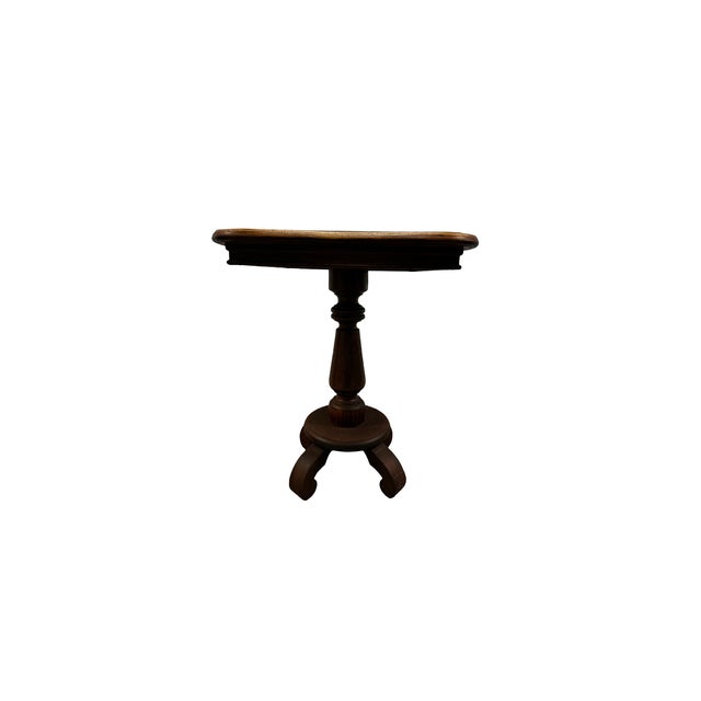 This charming antique oak pedestal table features a shapely scalloped-edge top supported by a beautifully turned central...