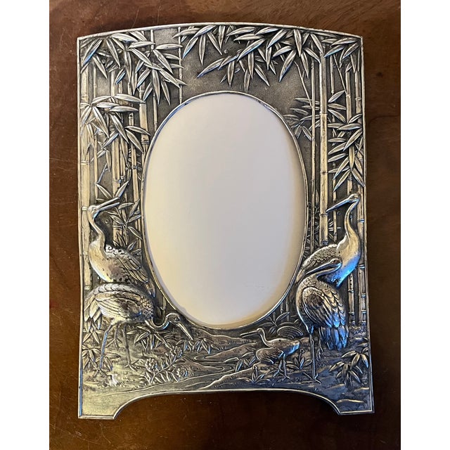 Antique 19th century Aesthetic Movement silver plate picture frame. Decorated with intricate birds and bamboo in high...