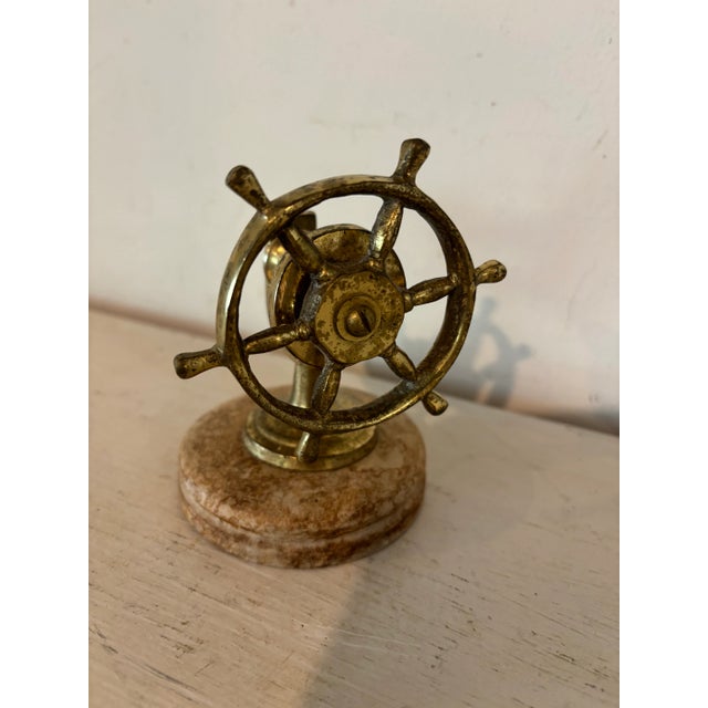 A fab little brass nutcracker in the shape of a ship’s wheel set atop a wooden base. Lovely detail. Hand selected in and...