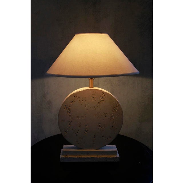 Experience the quiet luxury of Italian 80s design with this striking travertine lamp. Crafted in a sculptural structural-...