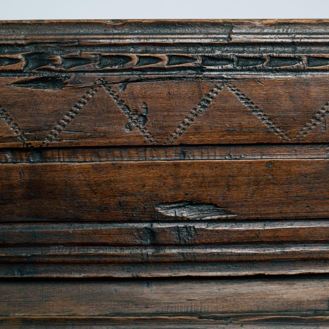 Chestnut two-seater siesta bench with carved decoration in the contoured front rail, Spain, early 18th century....
