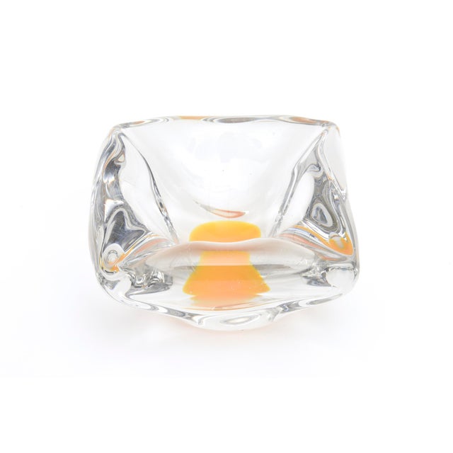 This vintage thick walled Swedish glass bowl has great weight. It looks like a perfect egg yolk of sunshine was dropped in...