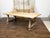 An Italian bleached oak farm table from the 19th century, with Baroque style base, incised carved floral and geometric...