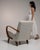 This chair carries genuine presence, its cream/oatmeal boucle upholstery immediately setting the tone for the piece....