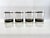Sophisticated mid-century barware set featuring four Culver lowball glasses paired with a coordinating black and gold ice...