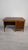Danish Teak Desk from the 1960s/1970s This solid teak desk from the 1960s/1970s features three drawers and a pull-out...