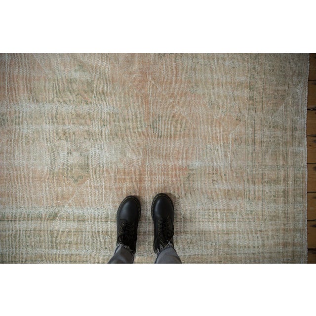 :: Center medallion with minor palmette finials atop an open abrashed ground with corner spandrel overlays loosely...