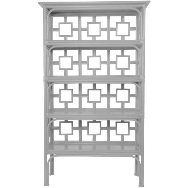 Classically styled, this étagère features a rattan frame with four wood shelves. Each joint is hand-wrapped with rawhide...