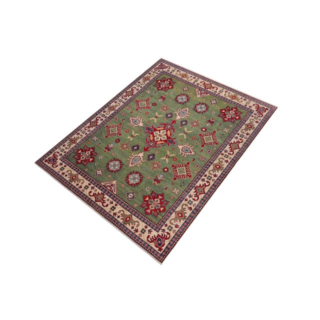 "Enhance your home with this exquisite hand-knotted Kazak rug, crafted from fine hand-spun wool and dyed with all-natural...