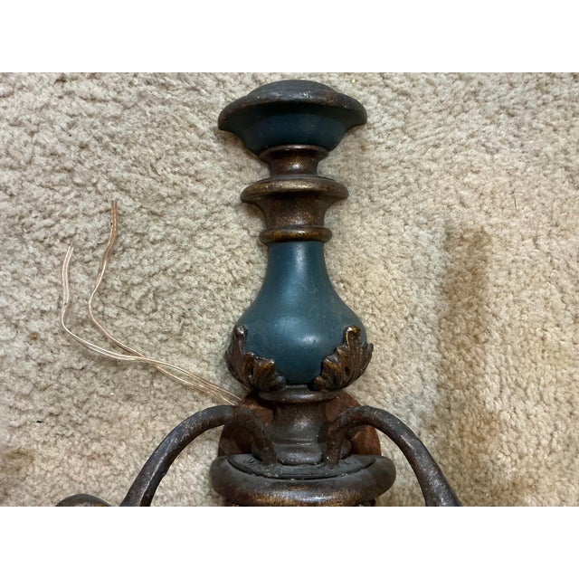 This is a pair of mid-century Italian carved giltwood sconces with original blue paint. They are both in working order and...