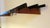 Teak, brass and metal wall mounted coat and hat rack dating from the 1960s, with 7 adjustable sliding hooks.