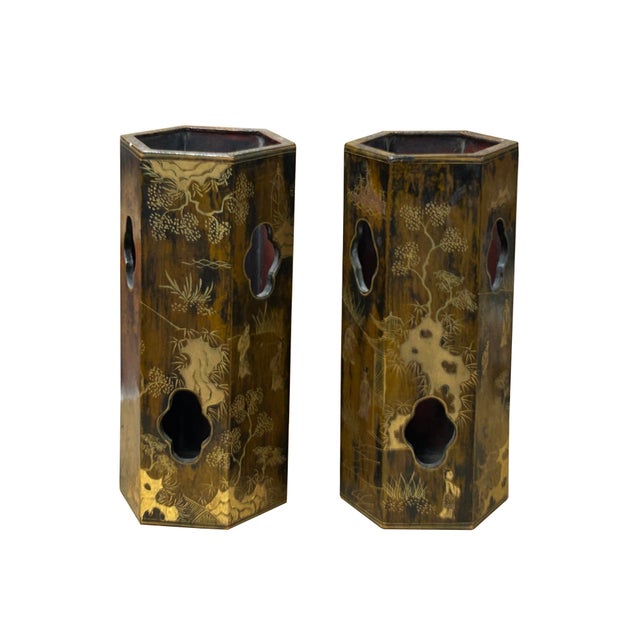 This pair of tall, cylindrical display pieces is crafted from wood with a hexagonal shape, showcasing exquisite artistry...