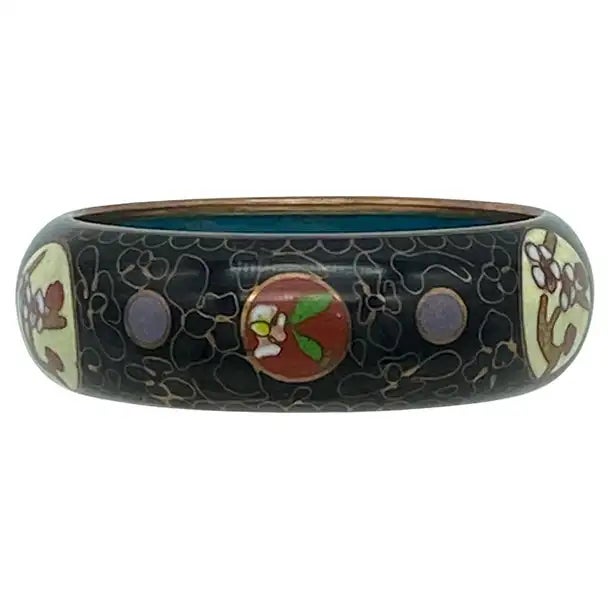 This around WWII pr. Chinese traditional handcrafted bangle features a wired brass and enamel flower pattern on black...