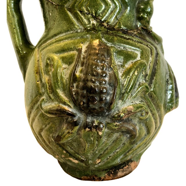 On offer is an antique Mexican folk art pottery pitcher, most likely originating from the historic ceramics hub of Atzompa...