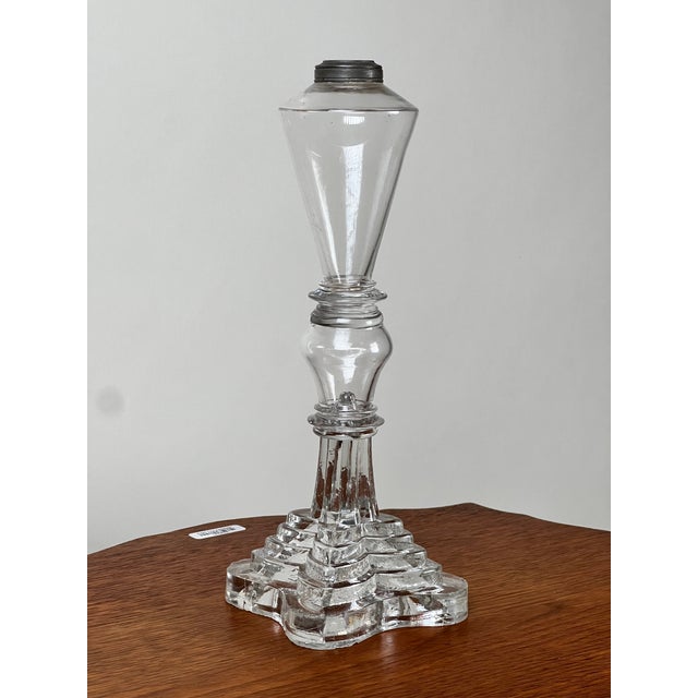 A handsome Sandwich Glass whale oil lamp dating to the mid-19th century, circa 1840. The lamp features a tapered hand-...