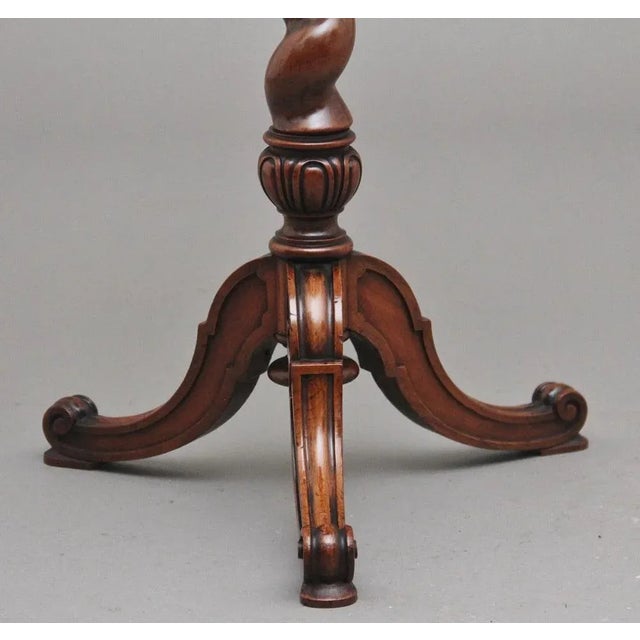 19th Century walnut wine / occasional table stamped Holland & Son. Having a wonderful figured and inlaid circular top...