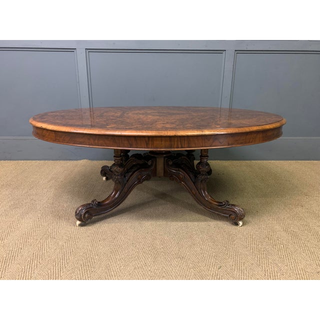 An attractive mid-Victorian period burr walnut coffee table. Of oval form and of generous proportions. Very well...