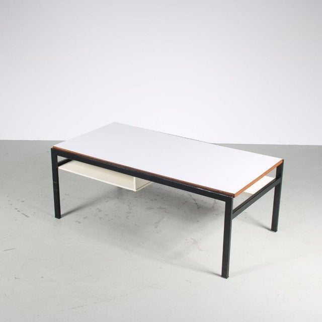 A highly recognizable coffee table designed by Cees Braakman, manufactured by Pastoe in the Netherlands around 1960. This...