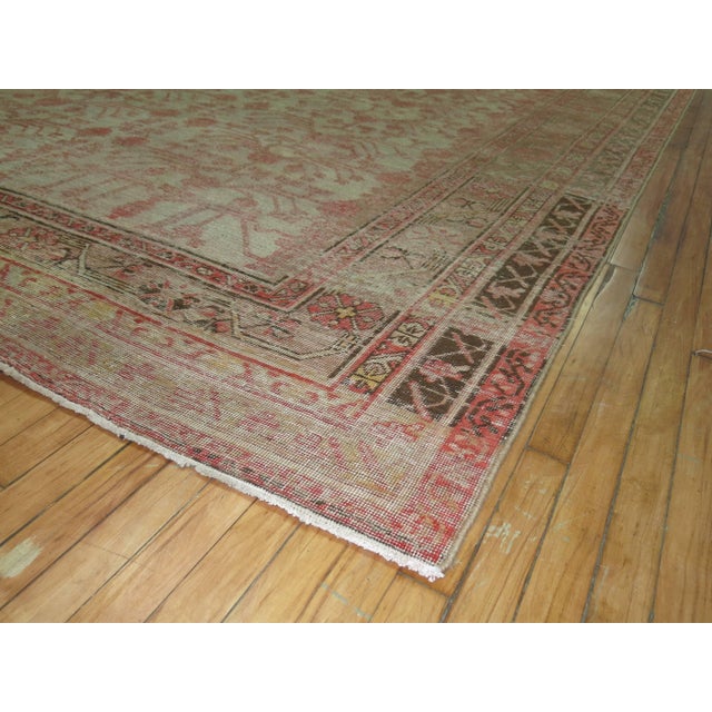 Large antique shabby chic Khotan rug with an all-over Pomegranate Design with faded red and brown hues on a gray ground...