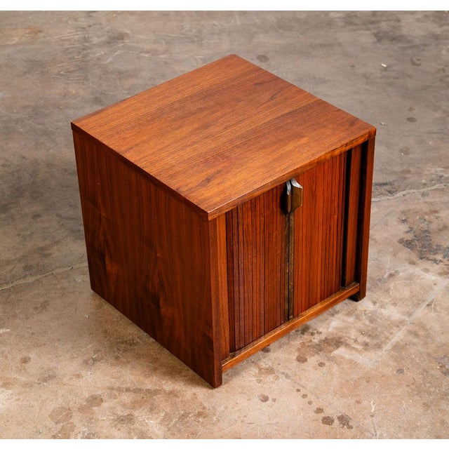 Square Mid Century Modern side table w/ tambour doors. Compact side table great for any home or space.