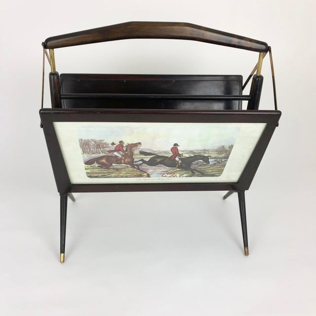 1950s foldable magazine rack in stained beechwood and brass detailing. Features men hunting on horses scenes on each side...