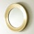 Large, round mirror from Glasmäster i Markaryd, made with a wide brass frame. Elegant and decorative. This piece has an...