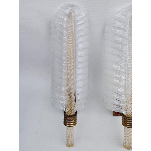Pair of Murano Glass Wall Sconces by Barovier and Toso. Mid-20th Century. Pair of Murano glass wall sconces with gold...
