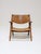 Early edition of the ch28 armchair, also known as sawbuck, designed by hans j. Wegner for carl hansen & søn in denmark,...
