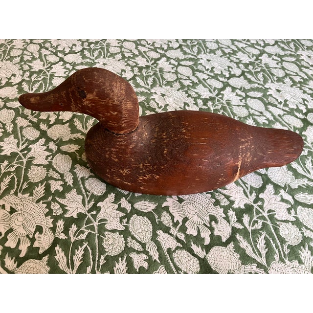 Vintage hand carved wooden duck decoy with beautiful rustic patina.