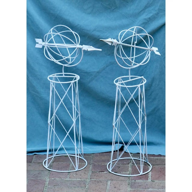 Mid 20th Century White Wire Topiary Frames With Globe & Arrow - A Pair. The frames are 31 inch tall and 10 inch in...