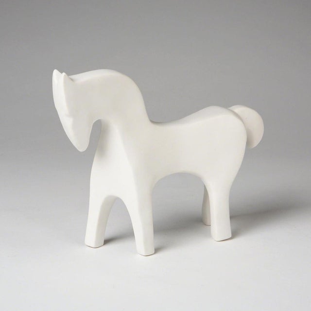 A complete set of five minimalist animal sculptures, unified by clean lines, soft geometry, and a refined matte white...