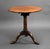 A good quality George III mahogany snap top circular tripod table, having a circular top on a revolving birdcage...