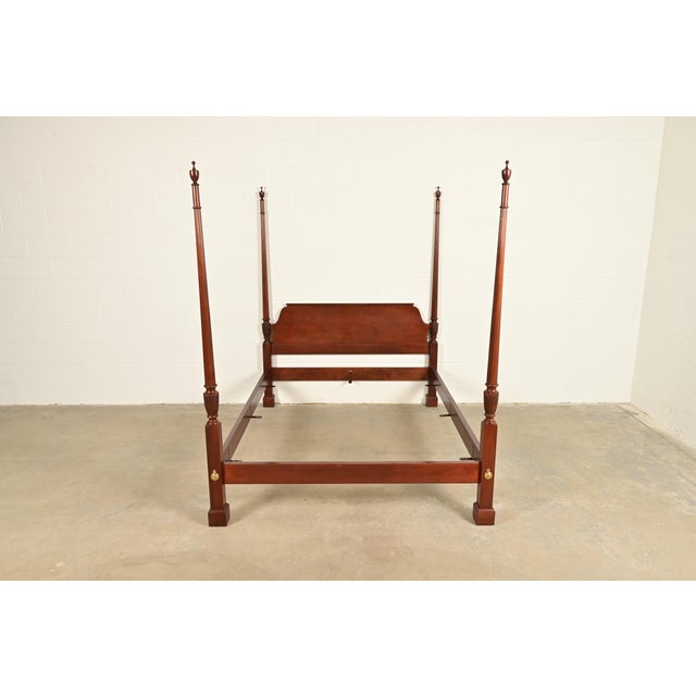 A gorgeous Georgian or Chippendale style four poster queen size bed By Baker Furniture USA, Circa 1980s Carved solid...