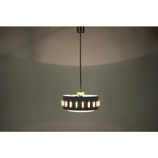 Grey Pendant Lamp, 1960s, in Very Good conditions. Designed 1960 to 1969 Up to 250V (Europe/UK Standard).The wiring of...