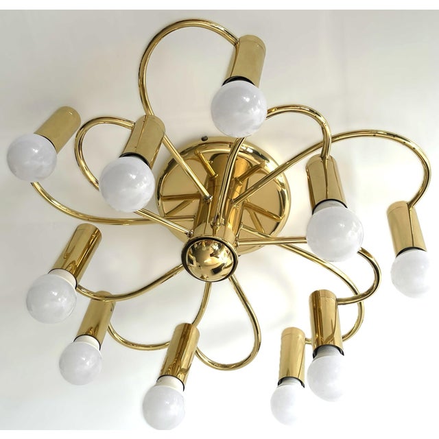 An elegant space age ten-light chandelier by honsel leuchten, a renowned german lighting manufacturer known for the...