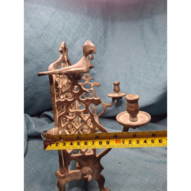 A rare and historically significant early 19th-century Polish "Bench" Hanukkah lamp. This piece represents the pinnacle of...