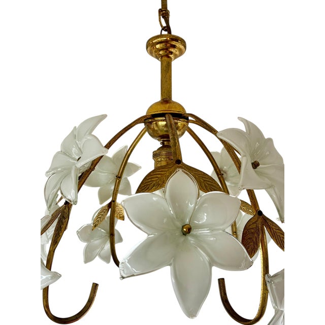 A refined vintage chandelier featuring handcrafted Murano Style glass daisy flowers, arranged in a delicate floral...
