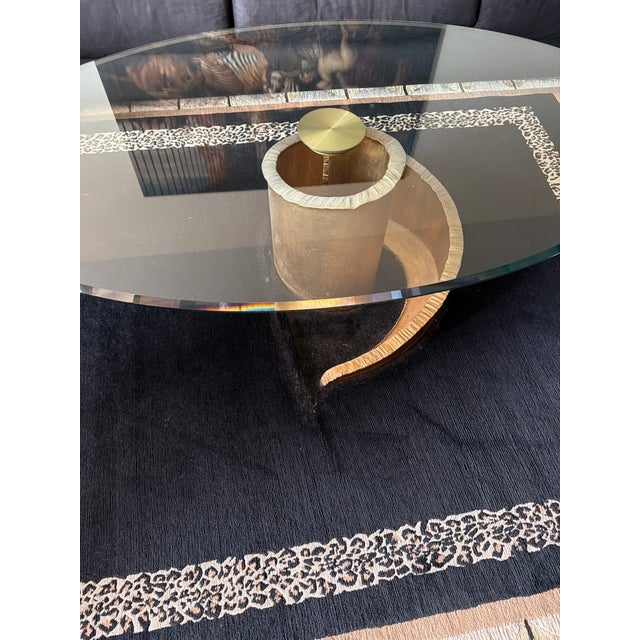 This coffee table is really striking. The only reason I am selling it, is because I am relocating and redecorating. It has...