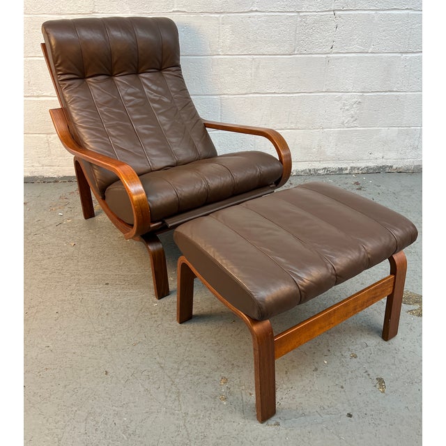 This is a vintage mid-century modern 'Orbit' lounge chair and ottoman designed by Ingmar Relling for Westnofa, featuring...