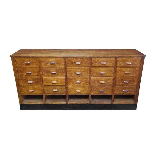 Stunning and antique pharmacy chest of drawers, produced in the 1930s in Italy, with 20 drawers and 5 open compartments in...