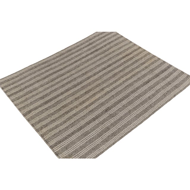 Handwoven in wool, a 7x8 vintage kilim rug from our newly unveiled flatweave curations. Originating from Turkey circa...