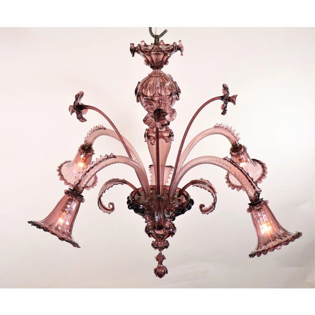 This authentic Murano chandelier elegantly models the thousand-year-old glassmaking tradition of Murano, an island set in...