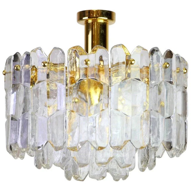 A wonderful gilt brass light fixture comprises crystal murano glass pieces on a gilded brass frame. Its made by kalmar...