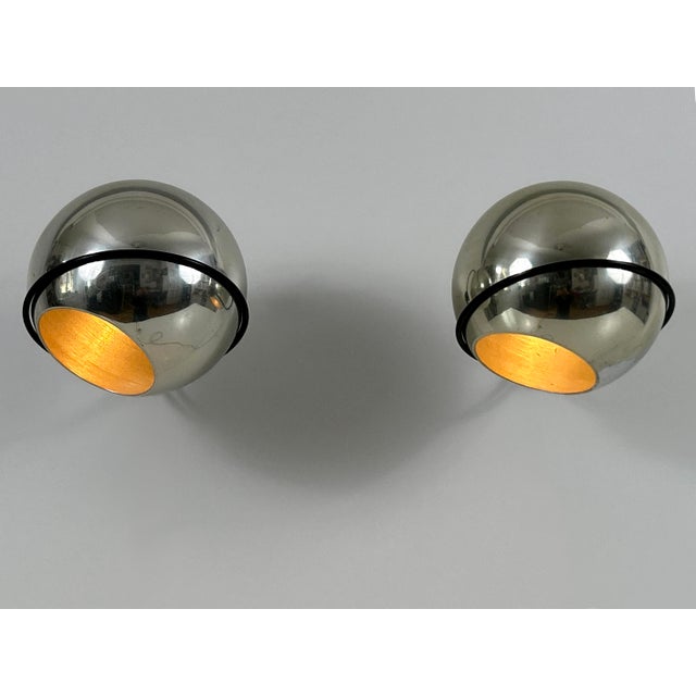 Set of two elegant and minimalistic mid-century modern spherical sconces or wall fixtures. Model 232/g. The fall of the...