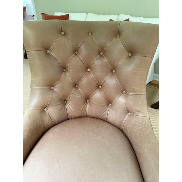 This classic leather chair has a sturdy construction and cinnamon-color natural leather. The chair is in excellent...