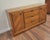 This 1960s Mid-Century Modern oak sideboard and credenza by Bernhardt Furniture features distinctive diagonal parquet door...
