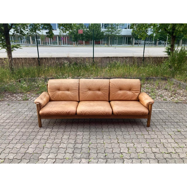 Beautiful vintage leather sofa from the 1970s upholstered in soft, high-quality aniline leather in a warm cognac/caramel...